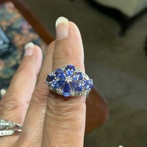 Colleen, Lopez, Tanzanite, and white topaz flower ring